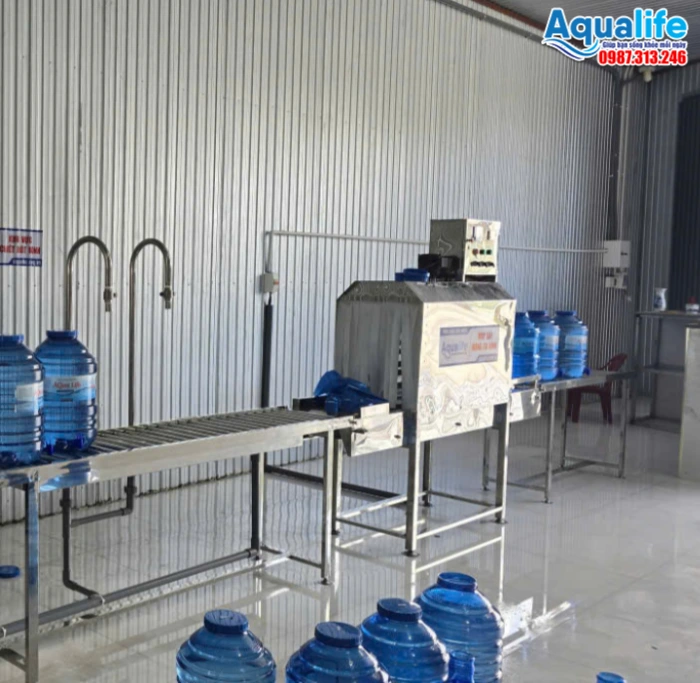 Hệ thống đóng gói bình nước 20L bằng màng co nhiệt